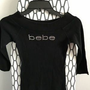 Bebe off shoulder black top. NWOT $29